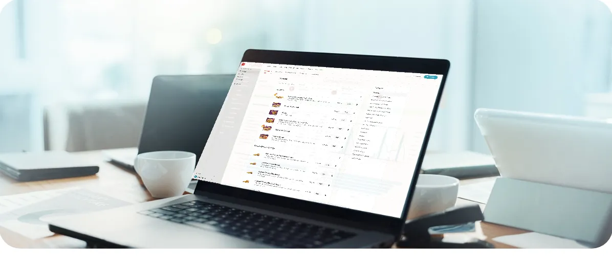 Operator managing menus and pricing on a laptop