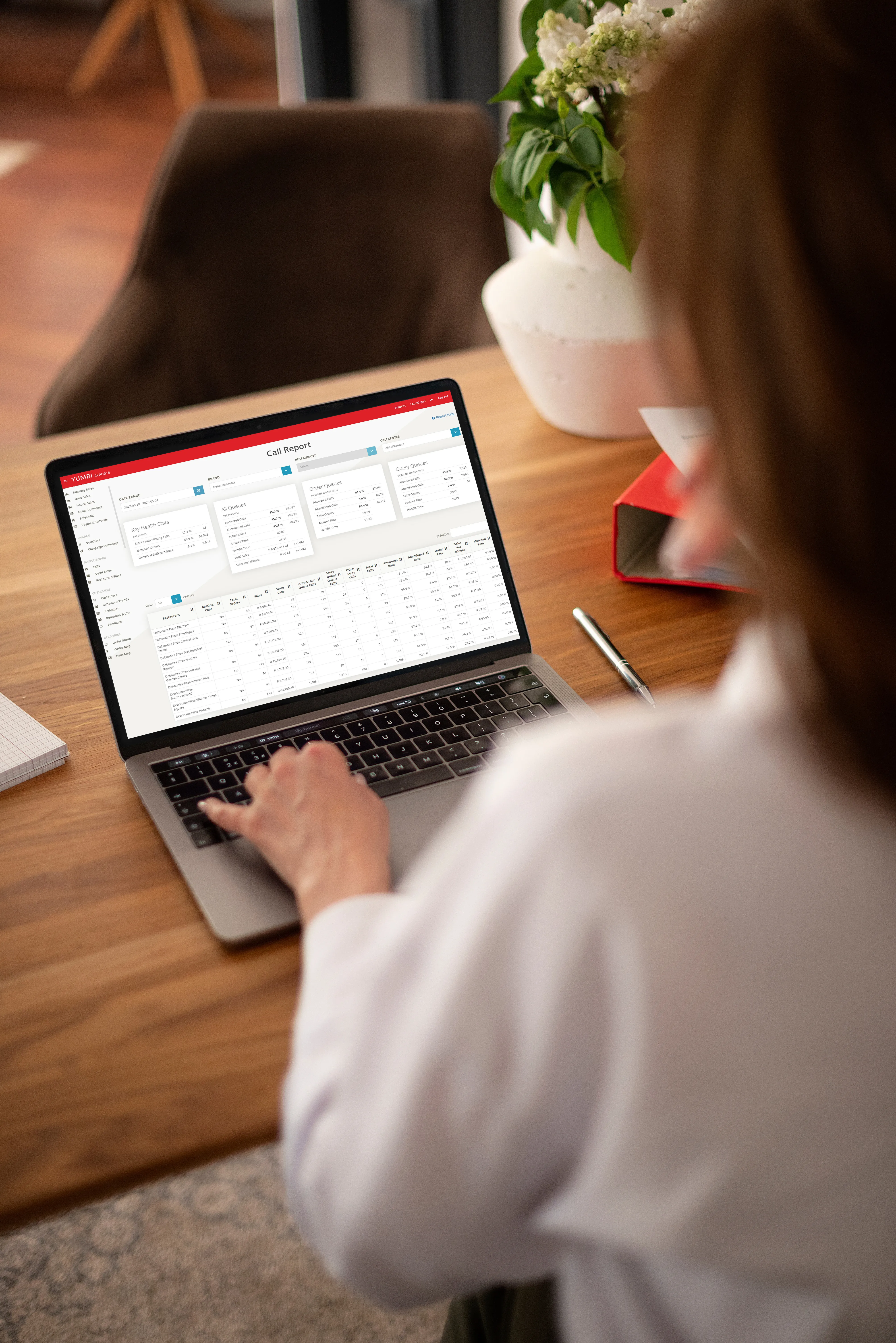 Restaurant manager resolving feedback on a tablet