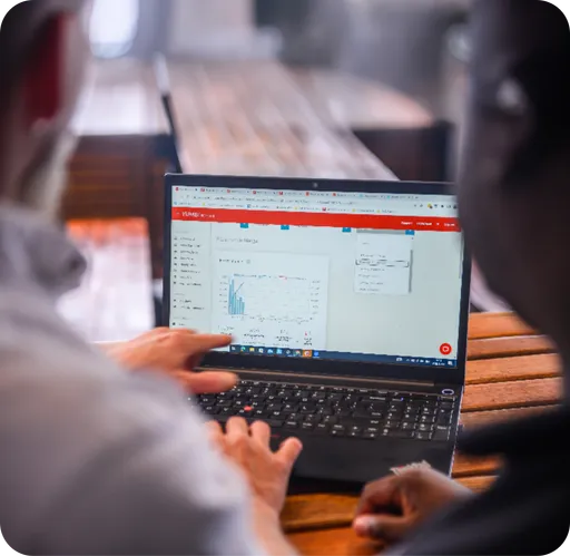 A restaurant operator reviewing YUMBI Reports with a YUMBI specialist