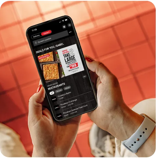 Customer browsing a branded YUMBI StoreFront app on a phone